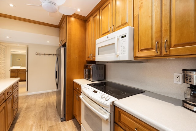 kitchen featuring crown molding, white appliances, ceiling fan, and light wood-type flooring