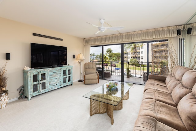 living room featuring carpet flooring and ceiling fan