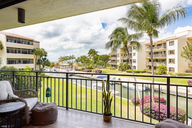 balcony featuring a water view