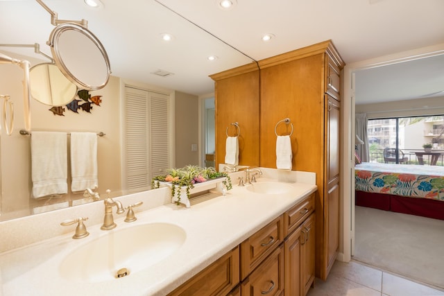 bathroom with tile patterned floors and vanity