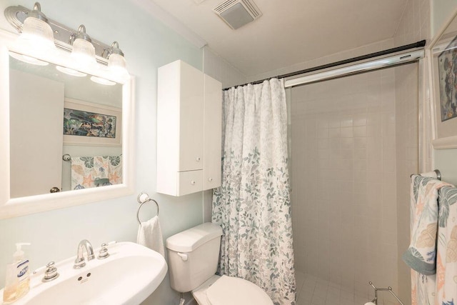 1617 Jamaica Dr, Key West, FL 33040 - bathroom featuring toilet, sink, and a shower with shower curtain