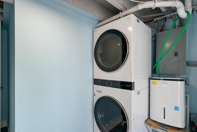 66 Seagate Blvd, Key Largo, FL 33037 - laundry area featuring estacked washer and dryer and electric panel