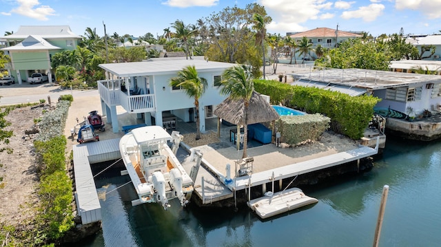 66 Seagate Blvd, Key Largo, FL 33037 - dock with a water view, boat lift, a residential view, and stairway