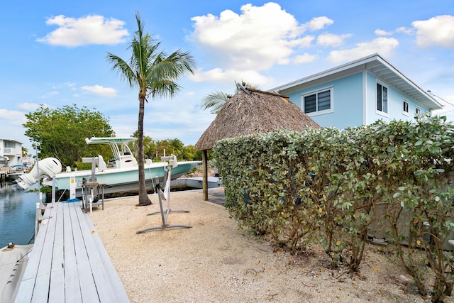 66 Seagate Blvd, Key Largo, FL 33037 - view of yard with boat lift, a dock, and a water view
