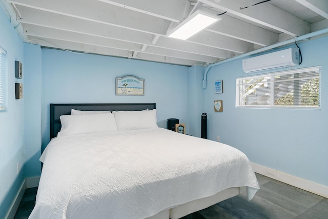 66 Seagate Blvd, Key Largo, FL 33037 - bedroom with a wall unit AC, baseboards, and wood finished floors