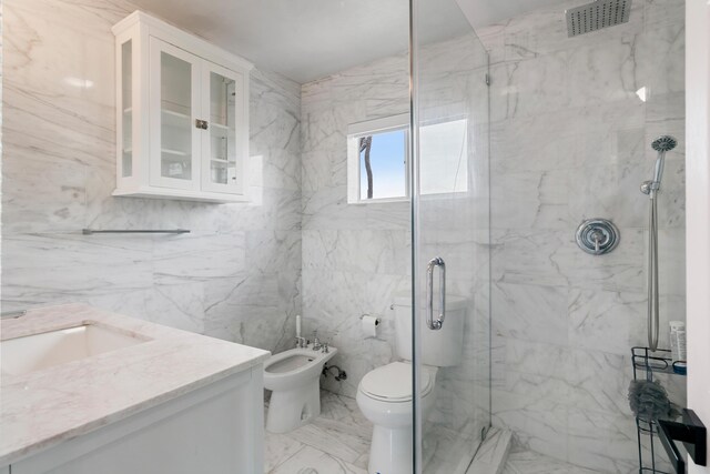 66 Seagate Blvd, Key Largo, FL 33037 - bathroom featuring a marble finish shower, a bidet, vanity, and marble finish floors