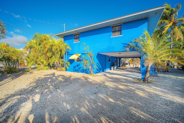 exterior space with a carport