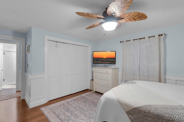 102 Sands Ln, Layton, FL 33001 - bedroom featuring wood finished floors, wainscoting, a closet, and ceiling fan