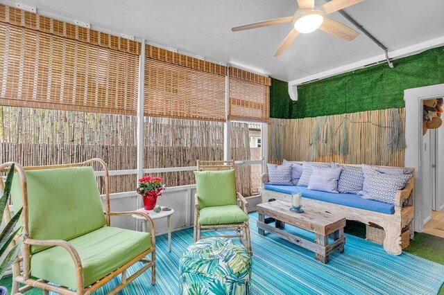 102 Sands Ln, Layton, FL 33001 - sunroom featuring outdoor lounge area and a ceiling fan