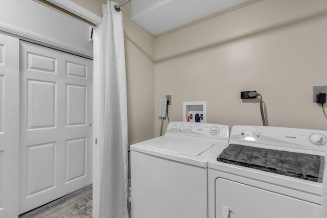 102 Sands Ln, Layton, FL 33001 - washroom with washer and clothes dryer and light wood-type flooring