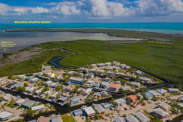 102 Sands Ln, Layton, FL 33001 - aerial view of property's location with a large body of water and nearby suburban area