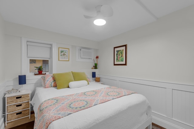 102 Sands Ln, Layton, FL 33001 - bedroom featuring a ceiling fan, wainscoting, and dark wood finished floors