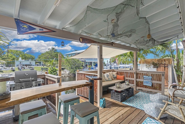 102 Sands Ln, Layton, FL 33001 - wooden deck with an outdoor living space