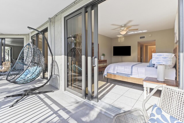 bedroom featuring light tile patterned floors and ceiling fan