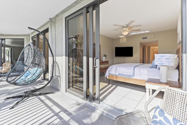 tiled bedroom with ceiling fan