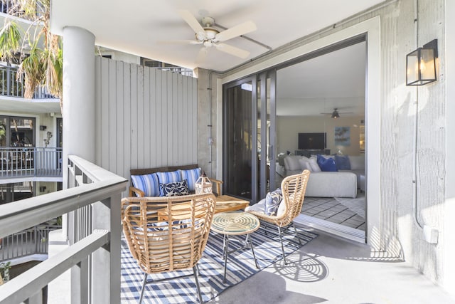 balcony featuring ceiling fan and an outdoor living space