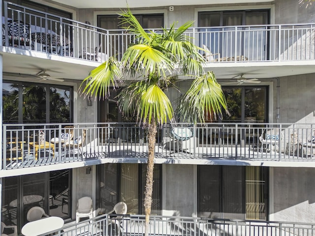 view of swimming pool featuring ceiling fan