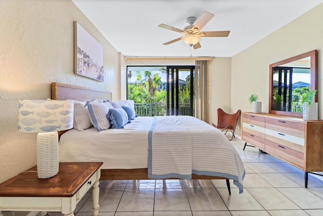 tiled bedroom featuring ceiling fan