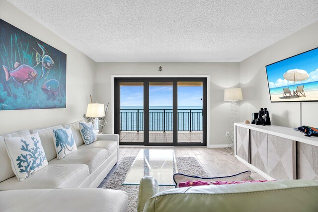 1001 W Ocean Dr Unit 1-305, Key Colony, FL 33051 - living room with wood finished floors and a textured ceiling