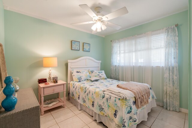 tiled bedroom with ceiling fan