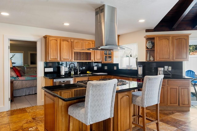 kitchen featuring island range hood, a kitchen breakfast bar, a center island, and stainless steel dishwasher