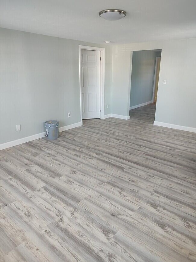 empty room with light hardwood / wood-style floors