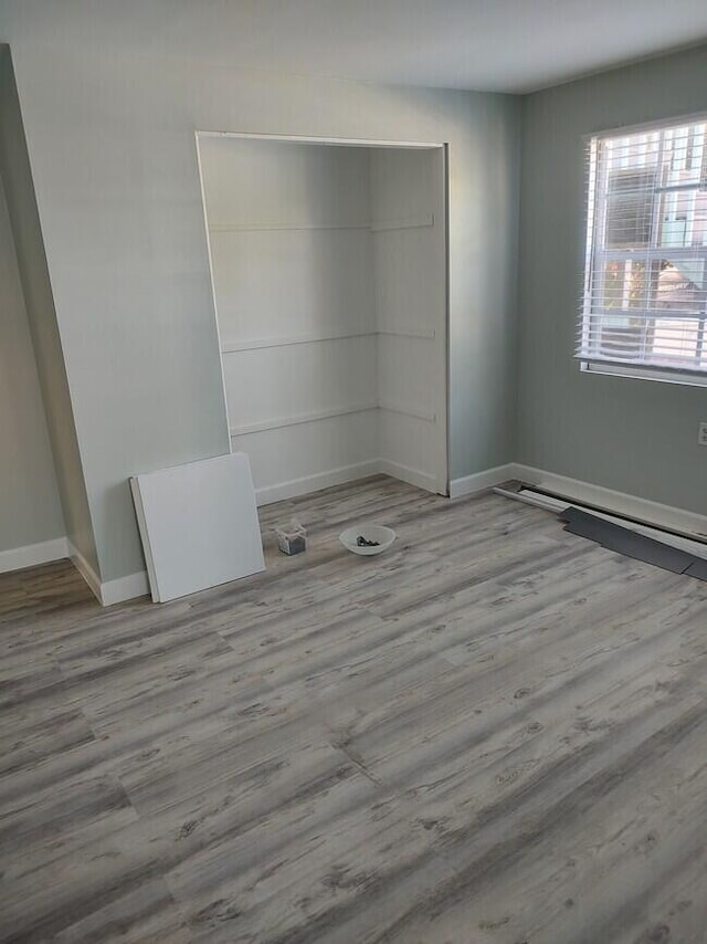 unfurnished room featuring light hardwood / wood-style floors