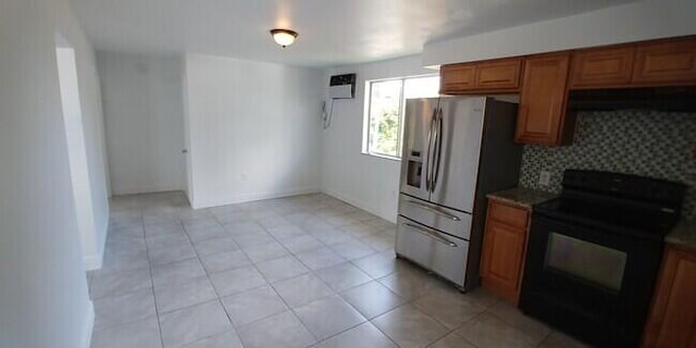 kitchen featuring electric range, stainless steel refrigerator with ice dispenser, decorative backsplash, exhaust hood, and an AC wall unit