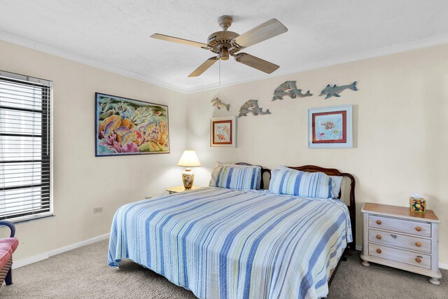 bedroom featuring crown molding, light carpet, and ceiling fan