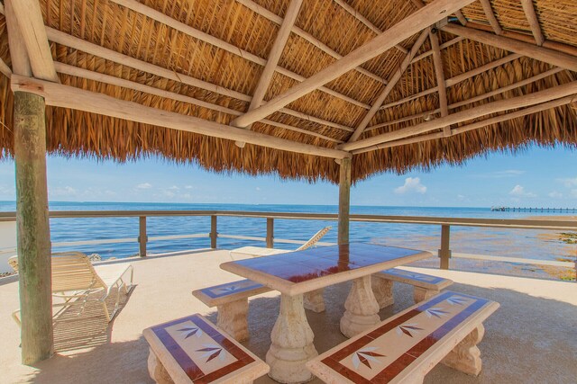 dock area featuring a gazebo and a water view