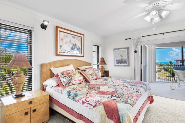 carpeted bedroom featuring ornamental molding, access to exterior, and multiple windows