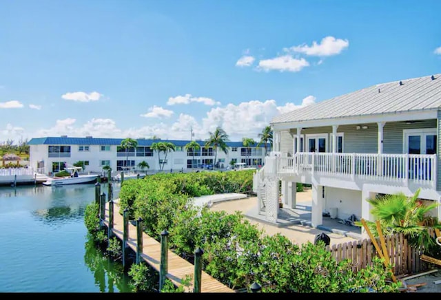 exterior space with a patio and a water view