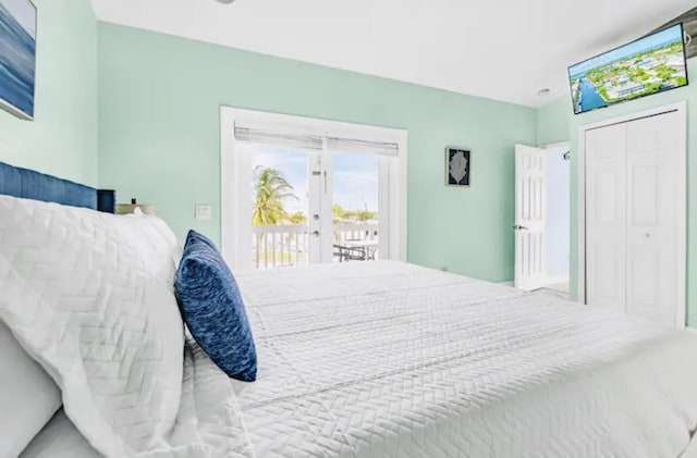 bedroom featuring a closet, access to exterior, and french doors