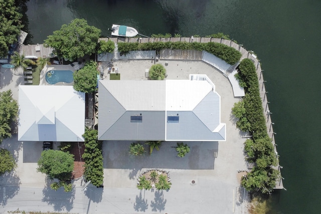 birds eye view of property with a water view