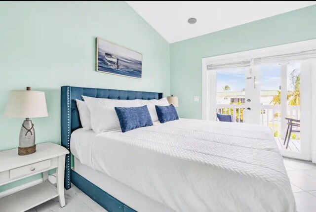 bedroom featuring vaulted ceiling and access to exterior