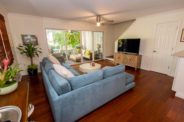 living room with ornamental molding, dark hardwood / wood-style floors, and ceiling fan