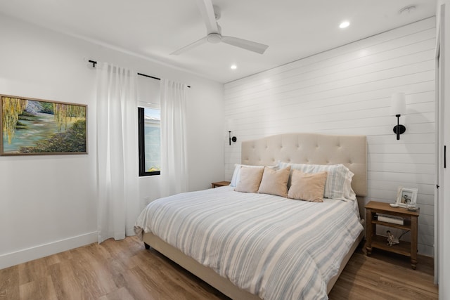 bedroom with wood-type flooring and ceiling fan