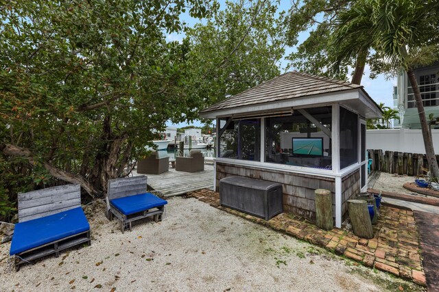 view of patio / terrace with outdoor lounge area and a sunroom