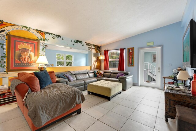 tiled living room with lofted ceiling