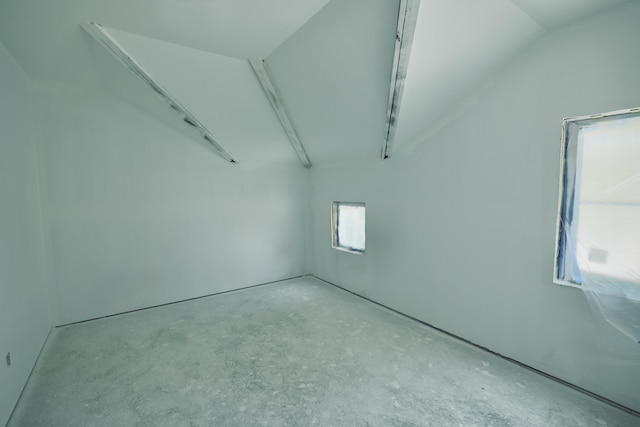 719 Bakers Ln, Key West, FL 33040 - spare room featuring concrete flooring and lofted ceiling