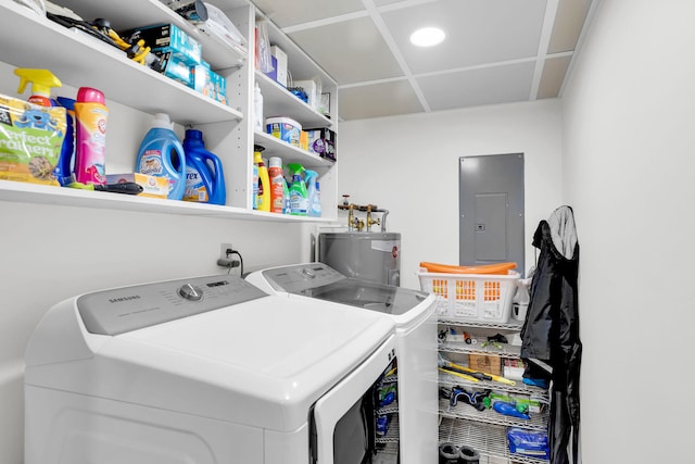 clothes washing area featuring separate washer and dryer, electric panel, and electric water heater