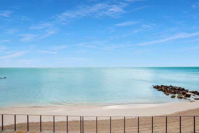 view of water feature with a beach view