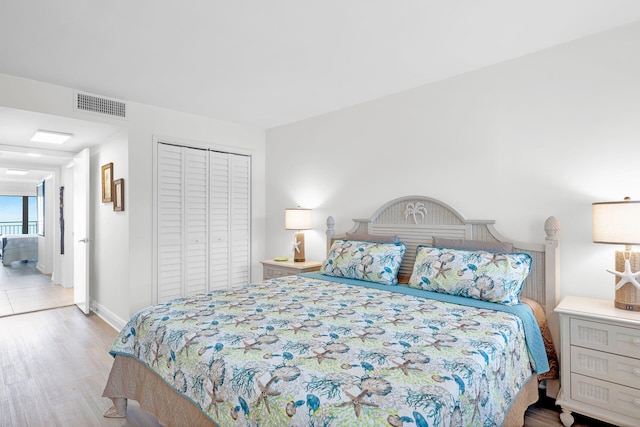 bedroom featuring a closet and light hardwood / wood-style flooring