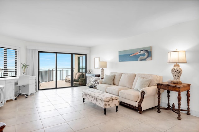 living room with built in desk and light tile patterned floors