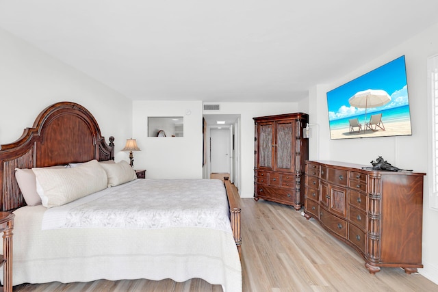 bedroom with light wood-type flooring