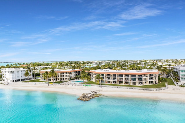 view of pool with a view of the beach and a water view