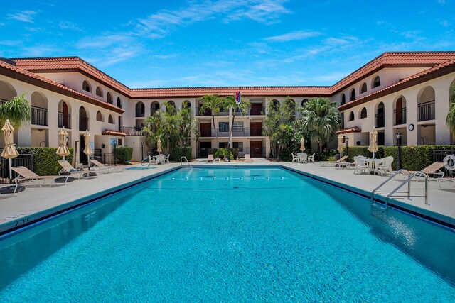 view of swimming pool with a patio