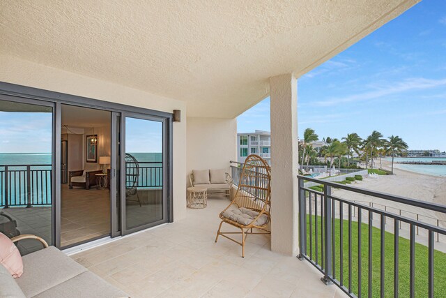 balcony featuring a water view