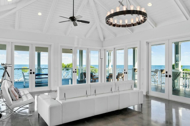 sunroom with wood ceiling, lofted ceiling with beams, french doors, and a water view