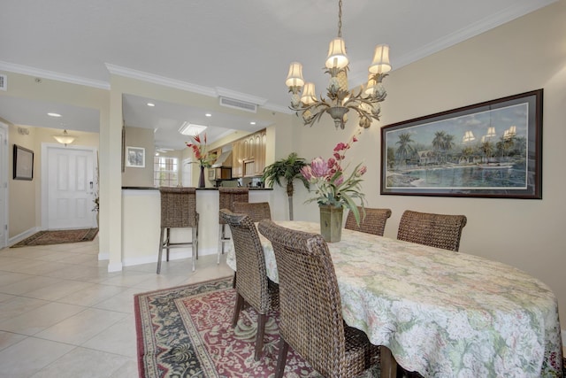 dining area featuring light tile patterned floors, a notable chandelier, and ornamental molding